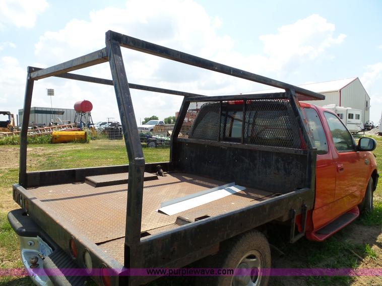 image for item J4898 1997 Ford F150 XLT flatbed pickup truck