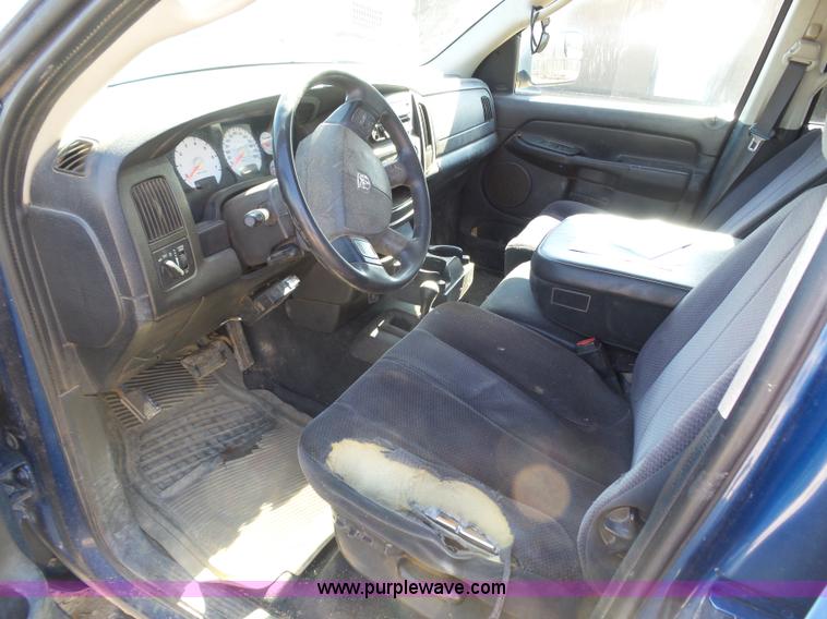 image for item J6042 2004 Dodge Ram 2500 Quad Cab flatbed pickup truck