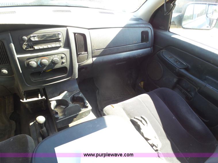 image for item J6042 2004 Dodge Ram 2500 Quad Cab flatbed pickup truck