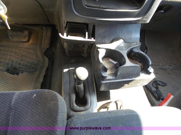 image for item J6042 2004 Dodge Ram 2500 Quad Cab flatbed pickup truck