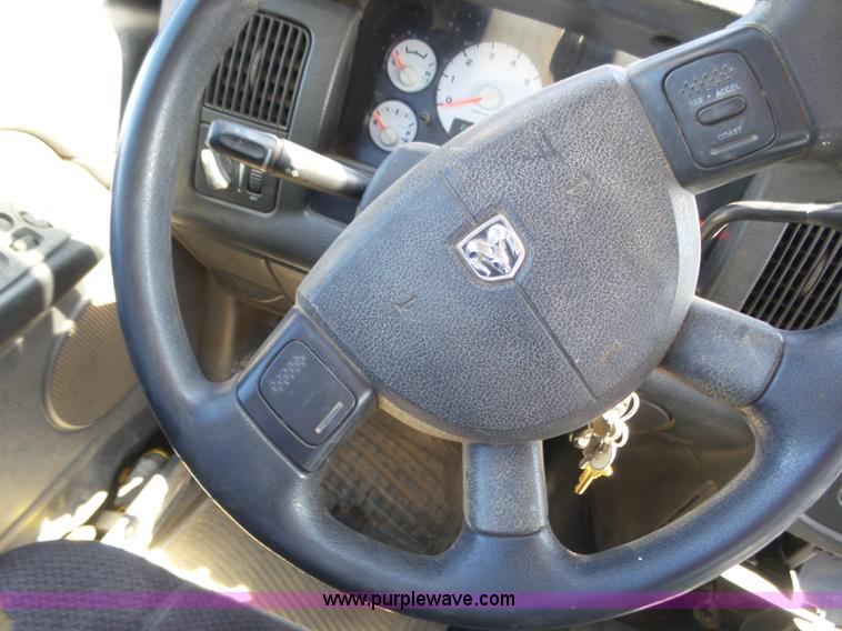 image for item J6042 2004 Dodge Ram 2500 Quad Cab flatbed pickup truck