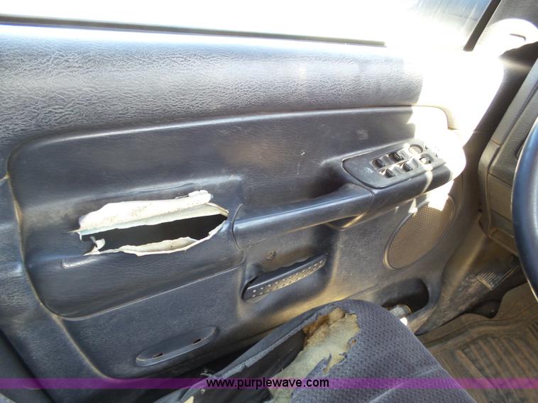 image for item J6042 2004 Dodge Ram 2500 Quad Cab flatbed pickup truck