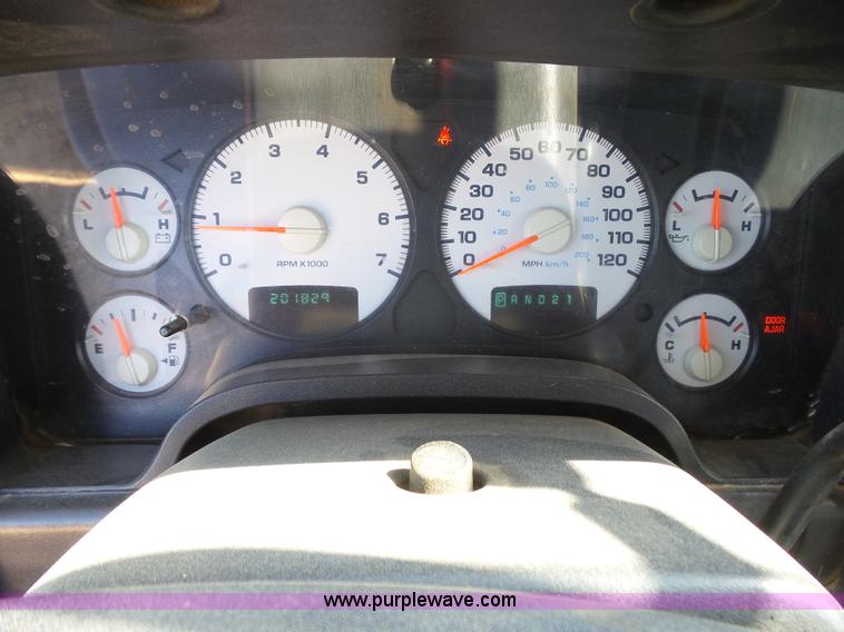 image for item J6042 2004 Dodge Ram 2500 Quad Cab flatbed pickup truck