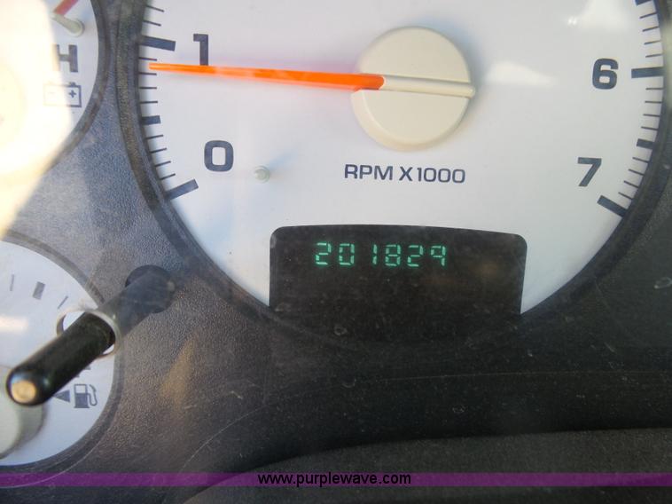 image for item J6042 2004 Dodge Ram 2500 Quad Cab flatbed pickup truck