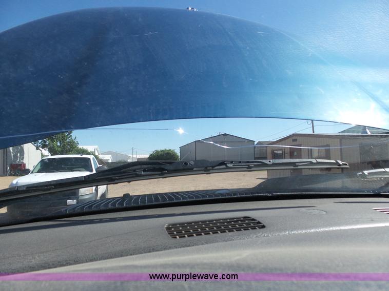 image for item J6042 2004 Dodge Ram 2500 Quad Cab flatbed pickup truck