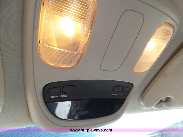 image for item J6042 2004 Dodge Ram 2500 Quad Cab flatbed pickup truck