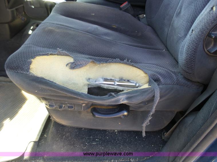 image for item J6042 2004 Dodge Ram 2500 Quad Cab flatbed pickup truck