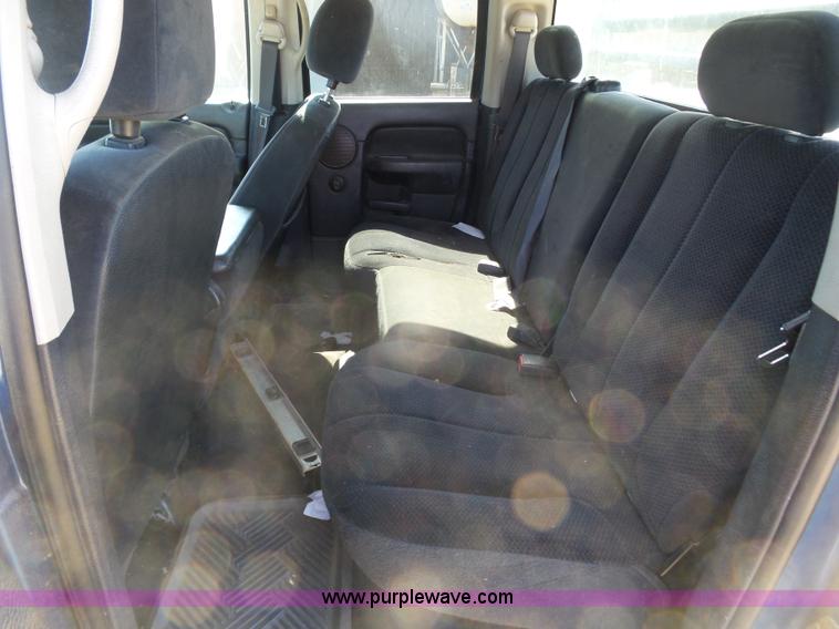 image for item J6042 2004 Dodge Ram 2500 Quad Cab flatbed pickup truck