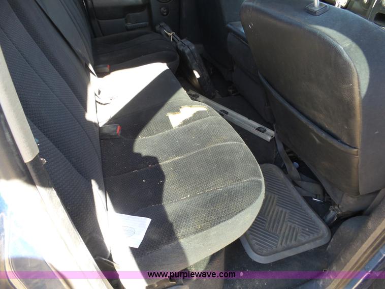 image for item J6042 2004 Dodge Ram 2500 Quad Cab flatbed pickup truck