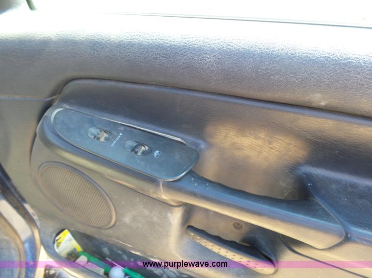 image for item J6042 2004 Dodge Ram 2500 Quad Cab flatbed pickup truck