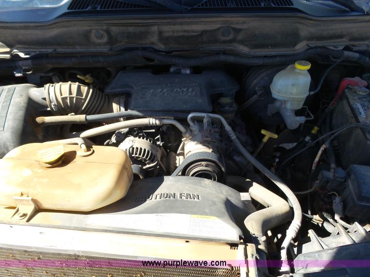 image for item J6042 2004 Dodge Ram 2500 Quad Cab flatbed pickup truck