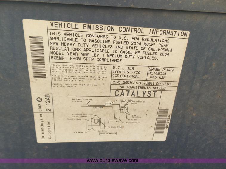 image for item J6042 2004 Dodge Ram 2500 Quad Cab flatbed pickup truck