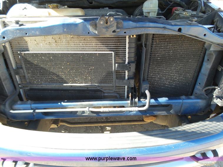 image for item J6042 2004 Dodge Ram 2500 Quad Cab flatbed pickup truck