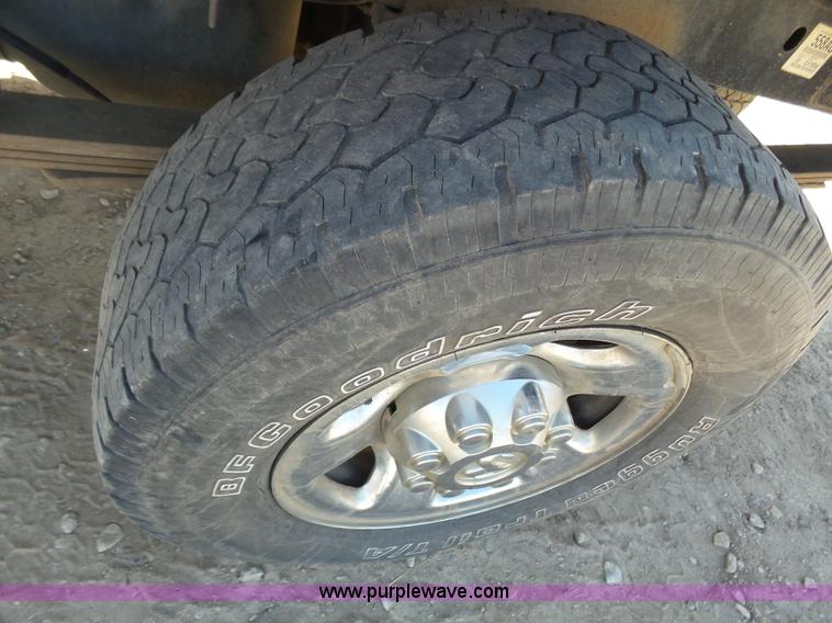 image for item J6042 2004 Dodge Ram 2500 Quad Cab flatbed pickup truck