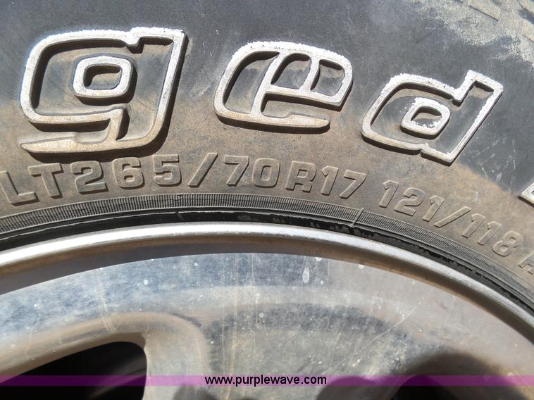 image for item J6042 2004 Dodge Ram 2500 Quad Cab flatbed pickup truck