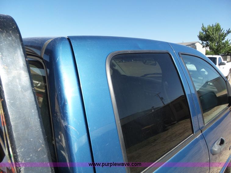 image for item J6042 2004 Dodge Ram 2500 Quad Cab flatbed pickup truck