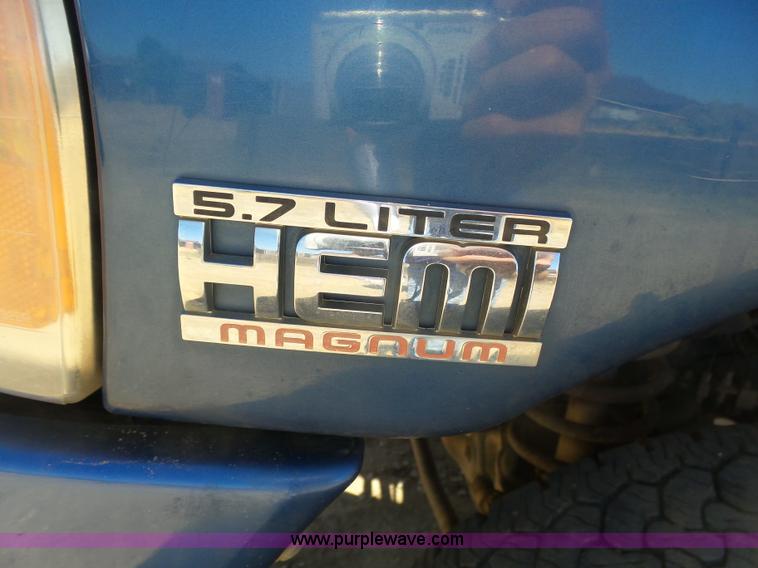 image for item J6042 2004 Dodge Ram 2500 Quad Cab flatbed pickup truck