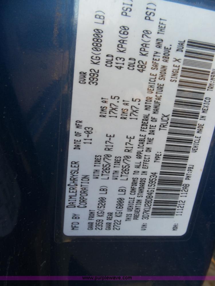 image for item J6042 2004 Dodge Ram 2500 Quad Cab flatbed pickup truck