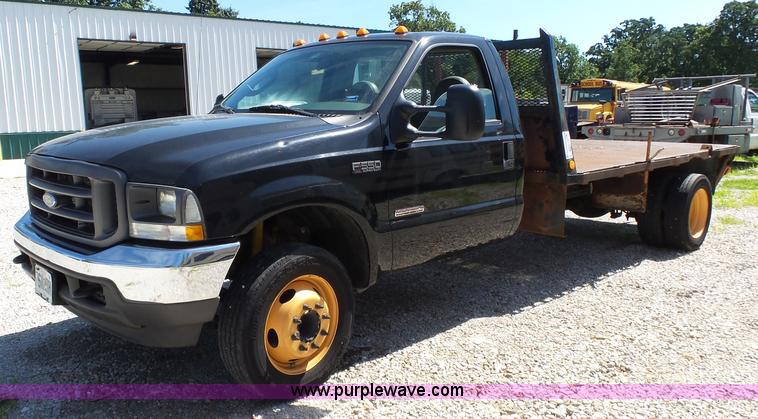 image for item K1192 2004 Ford F550 Crew Cab flatbed truck