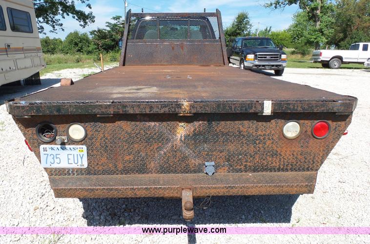image for item K1192 2004 Ford F550 Crew Cab flatbed truck