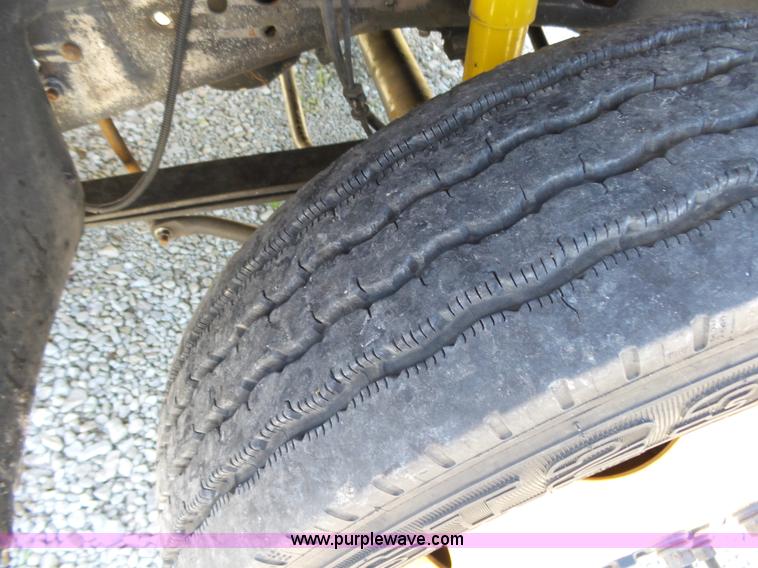 image for item K1192 2004 Ford F550 Crew Cab flatbed truck