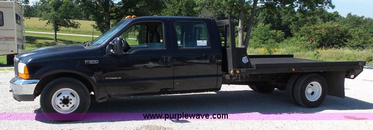 image for item K1193 2000 Ford F350 Super Duty Crew Cab flatbed pickup truck
