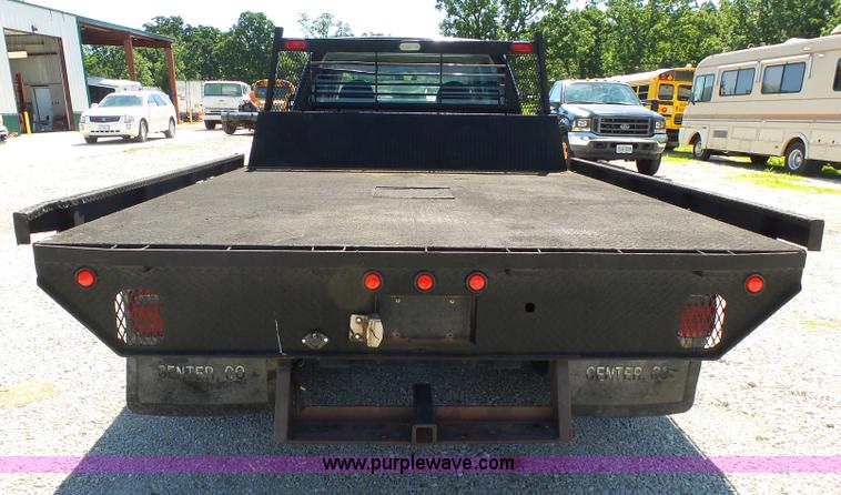 image for item K1193 2000 Ford F350 Super Duty Crew Cab flatbed pickup truck