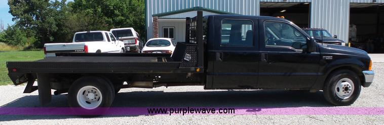 image for item K1193 2000 Ford F350 Super Duty Crew Cab flatbed pickup truck