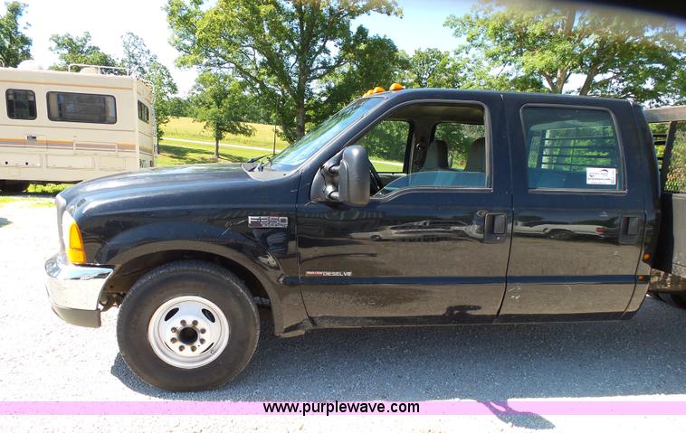 image for item K1193 2000 Ford F350 Super Duty Crew Cab flatbed pickup truck