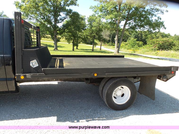 image for item K1193 2000 Ford F350 Super Duty Crew Cab flatbed pickup truck