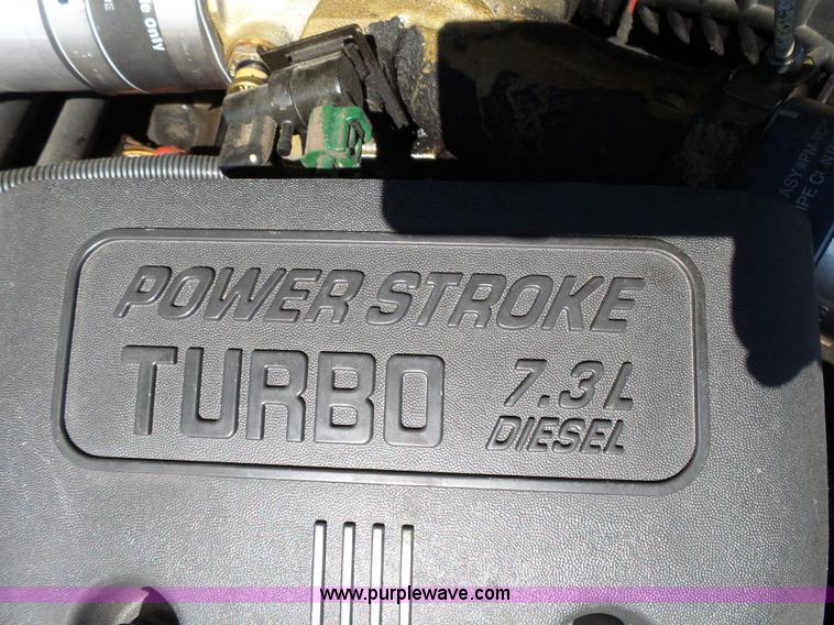 image for item K1193 2000 Ford F350 Super Duty Crew Cab flatbed pickup truck