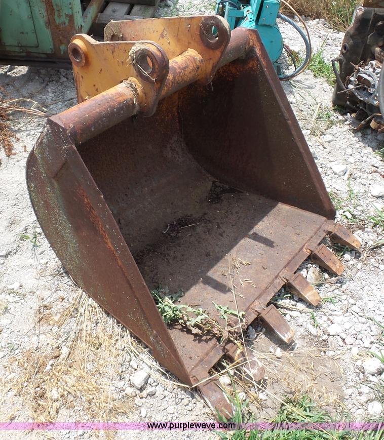 Case 580 backhoe bucket in Sibley, MO Item AV9948 sold Purple Wave