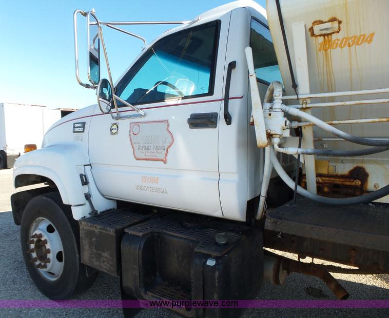 image for item K2190 1999 GMC C7500 spreader truck