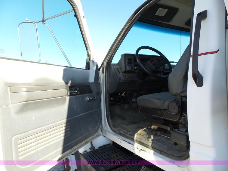 image for item K2190 1999 GMC C7500 spreader truck