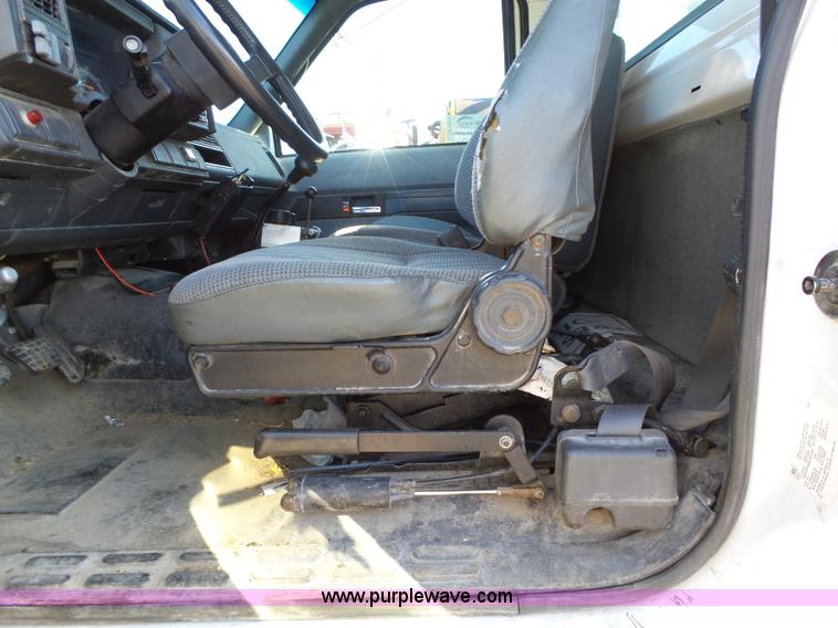 image for item K2190 1999 GMC C7500 spreader truck