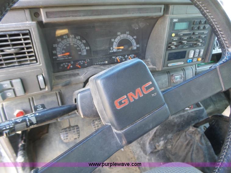 image for item K2190 1999 GMC C7500 spreader truck