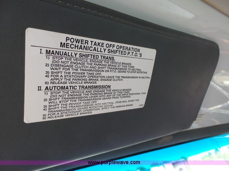 image for item K2190 1999 GMC C7500 spreader truck