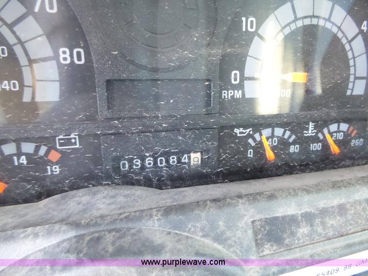 image for item K2190 1999 GMC C7500 spreader truck