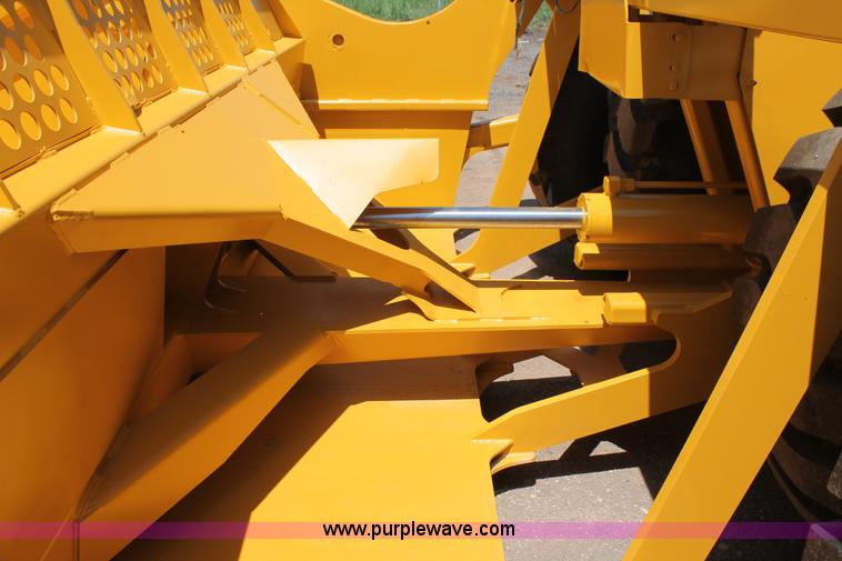 image for item K8795 2013 John Deere 2112E scraper