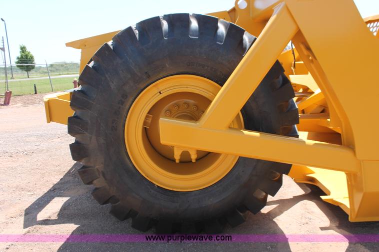 image for item K8795 2013 John Deere 2112E scraper