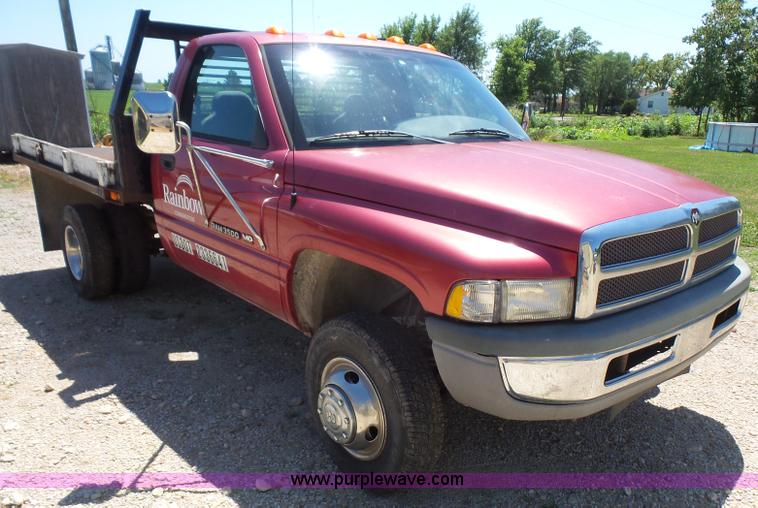 image for item L4838 1999 Dodge Ram 3500 flatbed pickup truck