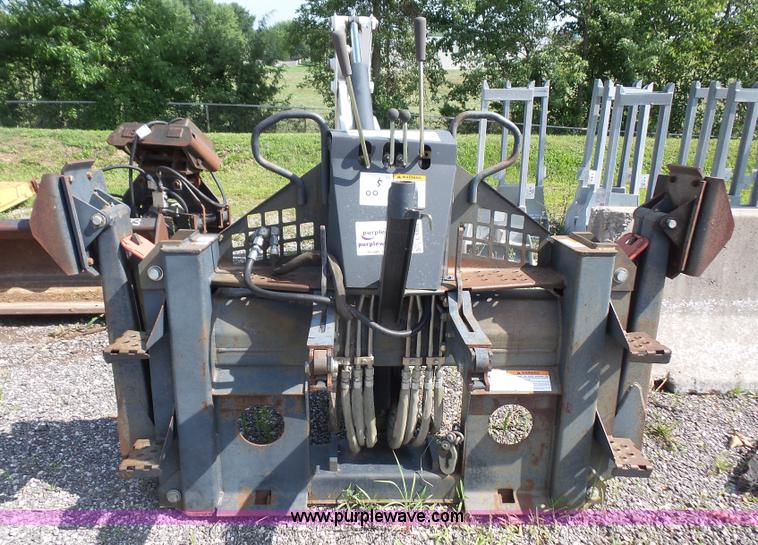 image for item L6802 Bobcat 8811 backhoe skid steer attachment