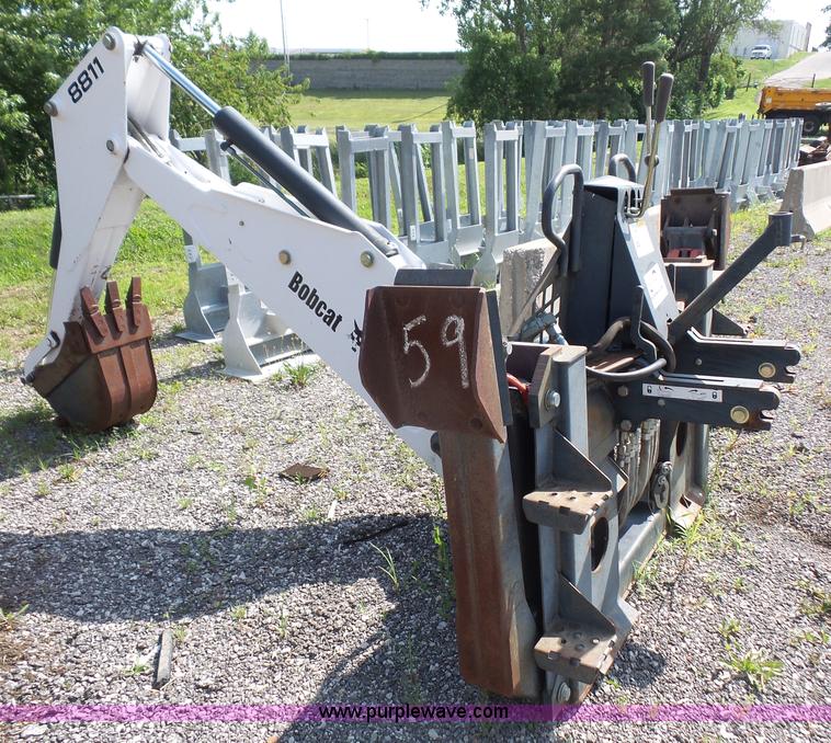 image for item L6802 Bobcat 8811 backhoe skid steer attachment