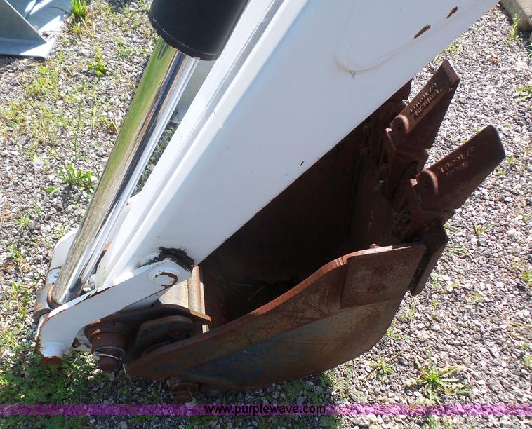 image for item L6802 Bobcat 8811 backhoe skid steer attachment
