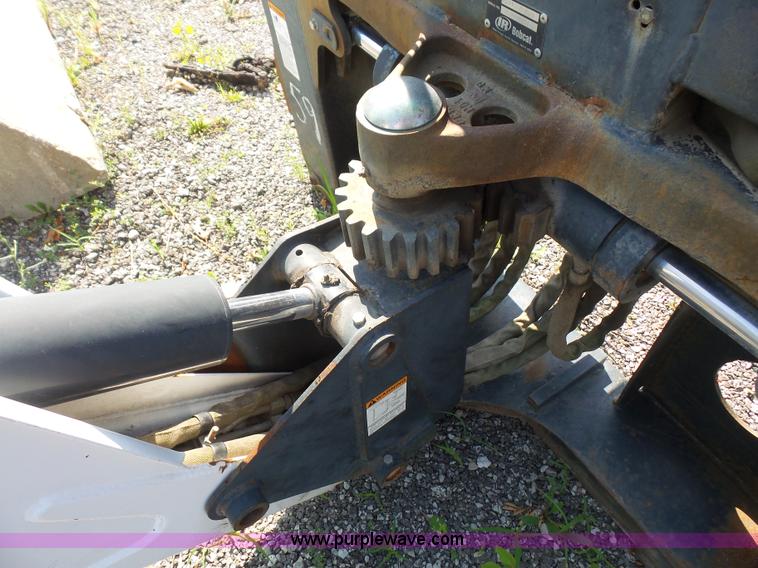 image for item L6802 Bobcat 8811 backhoe skid steer attachment