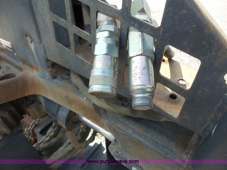 image for item L6802 Bobcat 8811 backhoe skid steer attachment