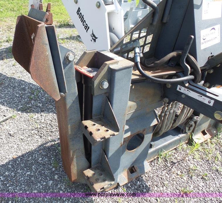 image for item L6802 Bobcat 8811 backhoe skid steer attachment