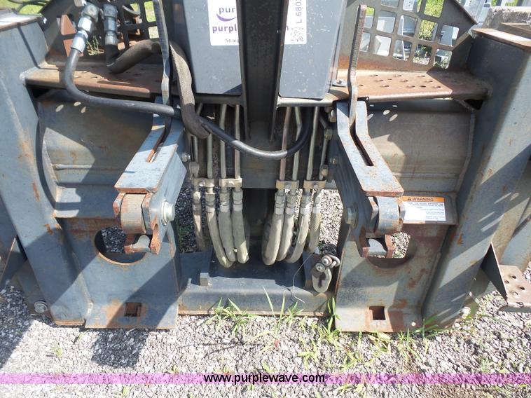 image for item L6802 Bobcat 8811 backhoe skid steer attachment