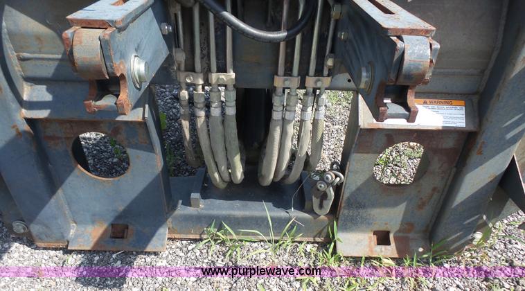 image for item L6802 Bobcat 8811 backhoe skid steer attachment