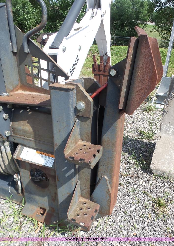 image for item L6802 Bobcat 8811 backhoe skid steer attachment